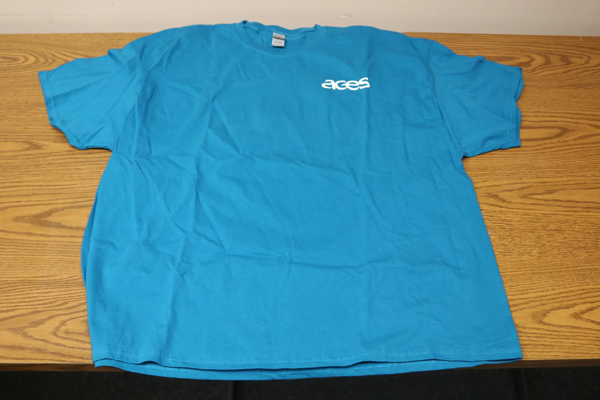 Aqua Tshirt with white ACES logo